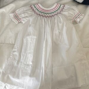 White smart dress with pink and green detail